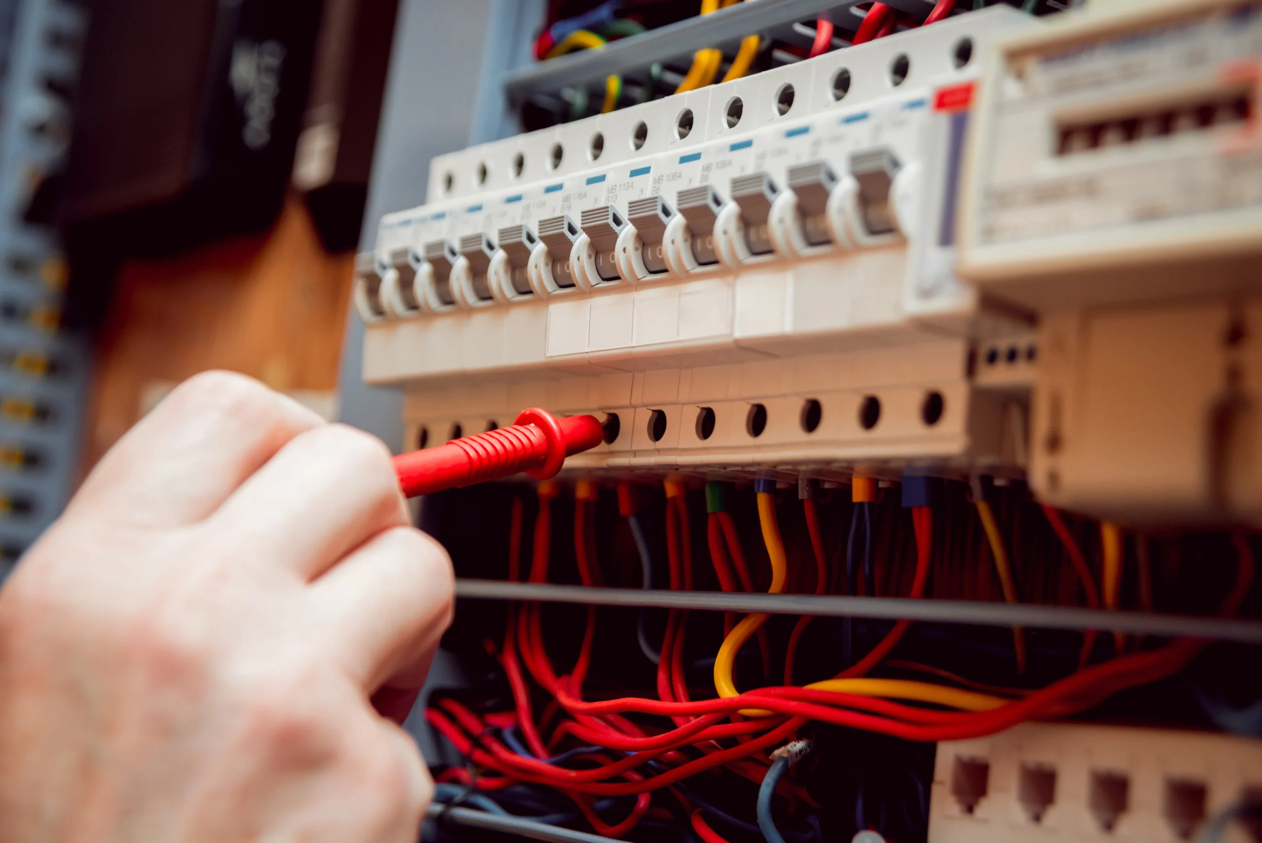 Electrical equipment. Tester in the hands. Background and texture